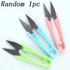 A set of three pink and teal U-shape sewing scissors for cutting yarn, fabric, and needlework.
