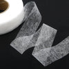 Roll of clear double-sided iron-on adhesive tape for garment repair