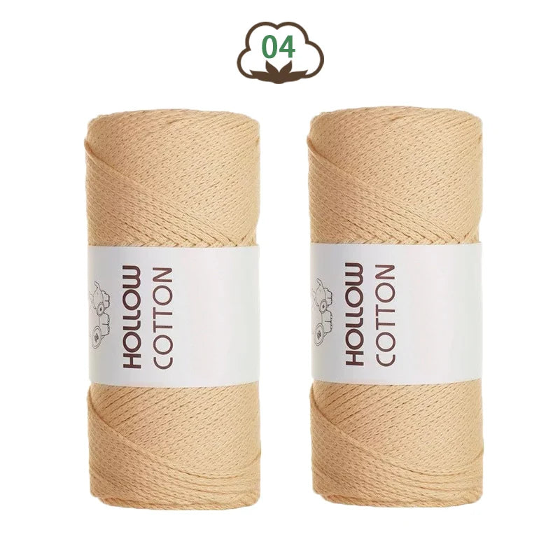 Two spools of natural beige hollow cotton yarn for DIY crafting