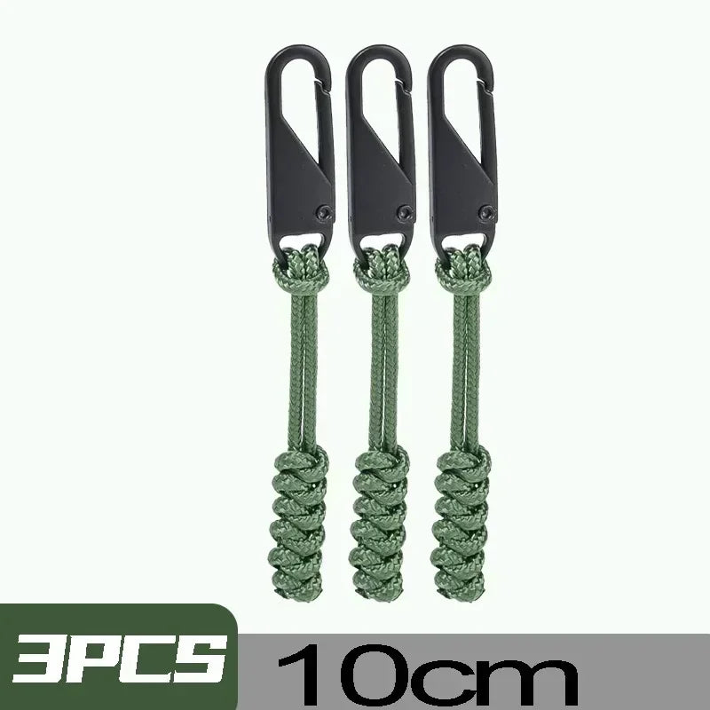 Three black detachable zipper pull sliders with green cord for bags and clothing