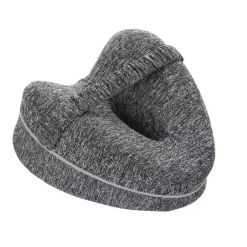 A gray memory foam knee pillow designed for side sleepers and pregnancy support.