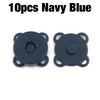 A pair of dark navy blue metal magnetic snap buttons for sewing.