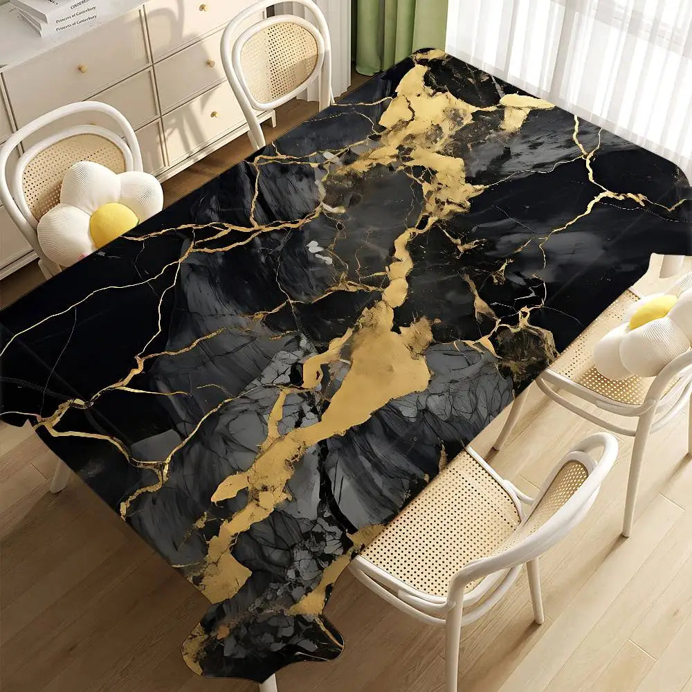 A black marble tablecloth with gold veining is displayed on a wooden floor next to white chairs.