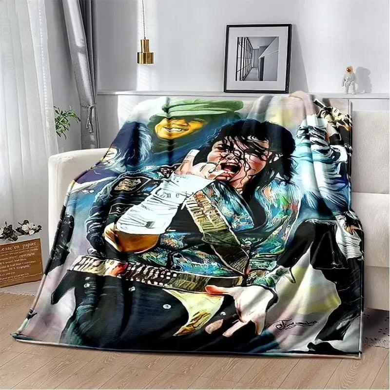 A printed flannel blanket featuring a portrait of a musician playing an electric guitar.