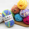 A collection of brightly colored premium milk cotton yarn skeins in various shades including yellow, pink, green, and blue.