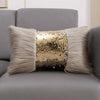 A decorative cushion cover featuring a gold sequin fabric surrounded by long, light gray faux fur.