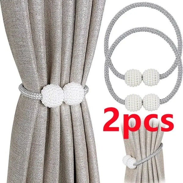 Gray fabric curtain with pearl magnetic tie back clips shown alongside two sets of clips