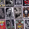 A collection of black embroidery patches featuring skulls, demons, and gothic imagery for clothing.