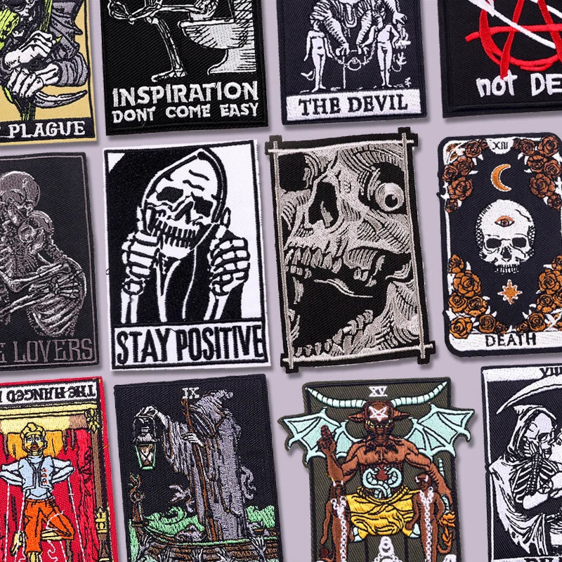 A collection of black embroidery patches featuring skulls, demons, and gothic imagery for clothing.