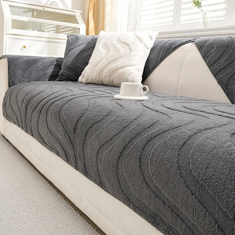 A gray textured sofa cushion cover with a white mug resting on it, displayed on a light-colored sofa.