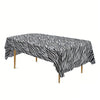 Black and white zebra print disposable plastic tablecloth spread on a table.
