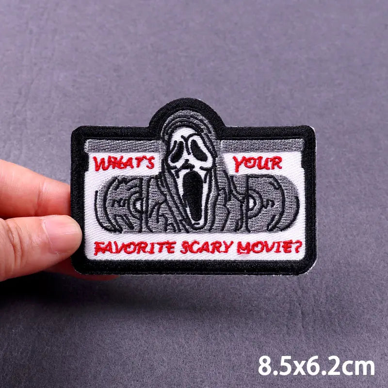 Black embroidered patch featuring a skull face asking What's your favorite scary movie?