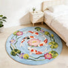 Round rug featuring a colorful pattern of koi fish and flowers on a light blue background.
