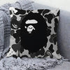 A decorative pillow cover featuring a black and white camouflage print of a lion's head.