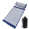 A dark blue acupressure relief mat and pillow set with white dots for pain and stress relief.