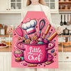 Pink kitchen apron featuring a baking design with various pink and colorful baked goods.