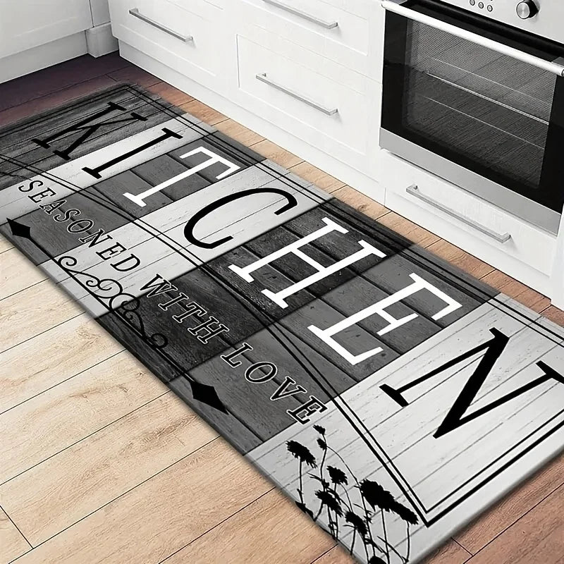 A rectangular kitchen mat with distressed wood texture and black lettering that reads Kitchen Seasoned with Love