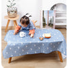 A baby is playing on a light blue waterproof play mat with anti-slip backing, featuring a design of crescent moons.