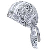 A white paisley print unisex headwrap tied with a decorative knot.