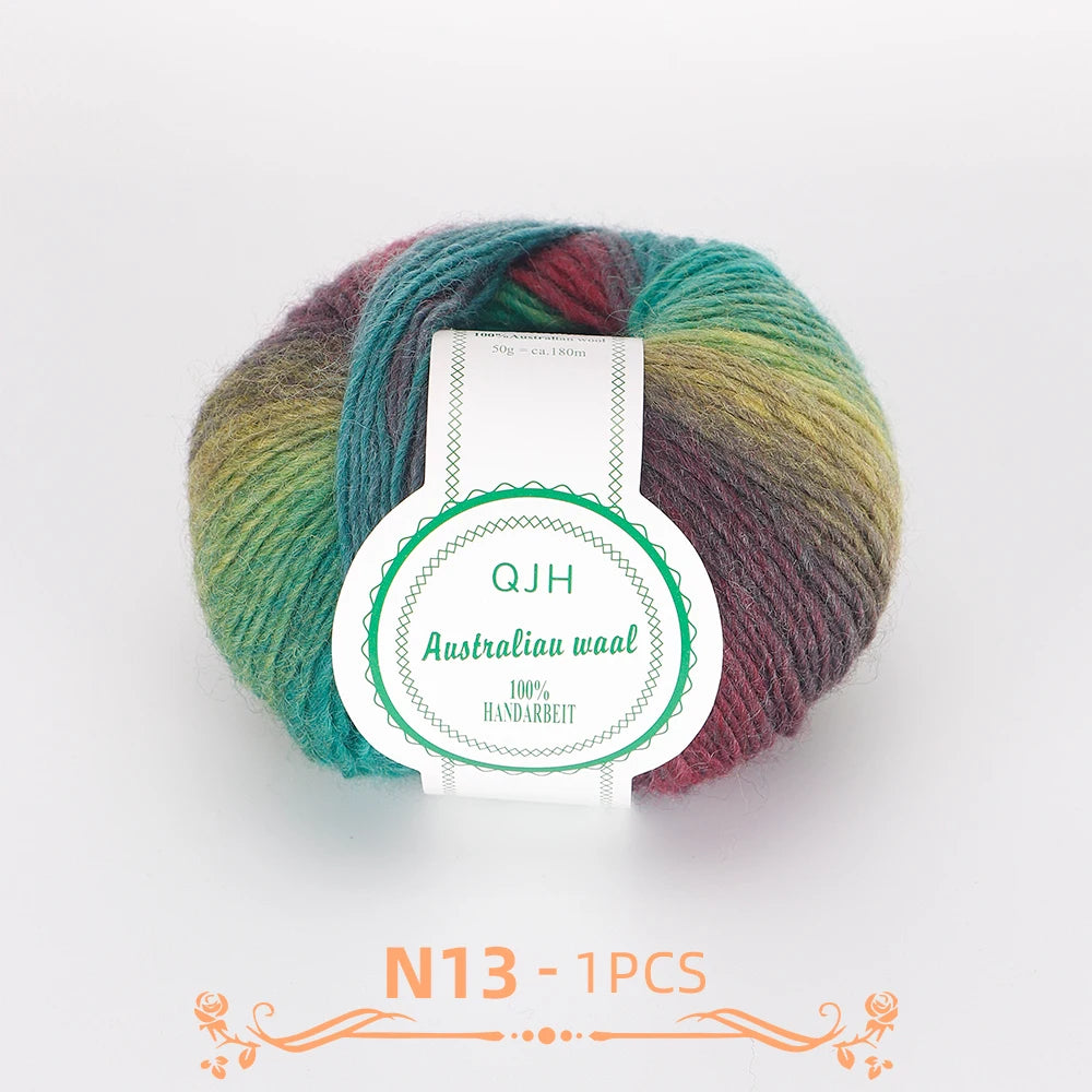 A ball of multi-colored wool yarn with a label indicating QJH Australiau waal 100% handarbeid