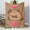A tan flannel blanket featuring a large cartoon bear face and small bear figures, displayed against a white background.