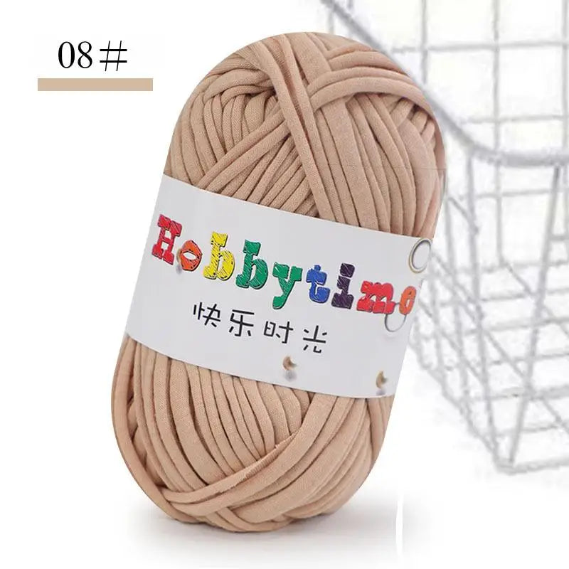 A ball of thick, light beige craft yarn used for knitting and crochet projects.
