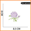 Set of 5 light purple embroidered butterfly and rose iron-on patches.