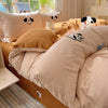 A beige and brown cartoon embroidered bedding set featuring dog faces for kids and adults.