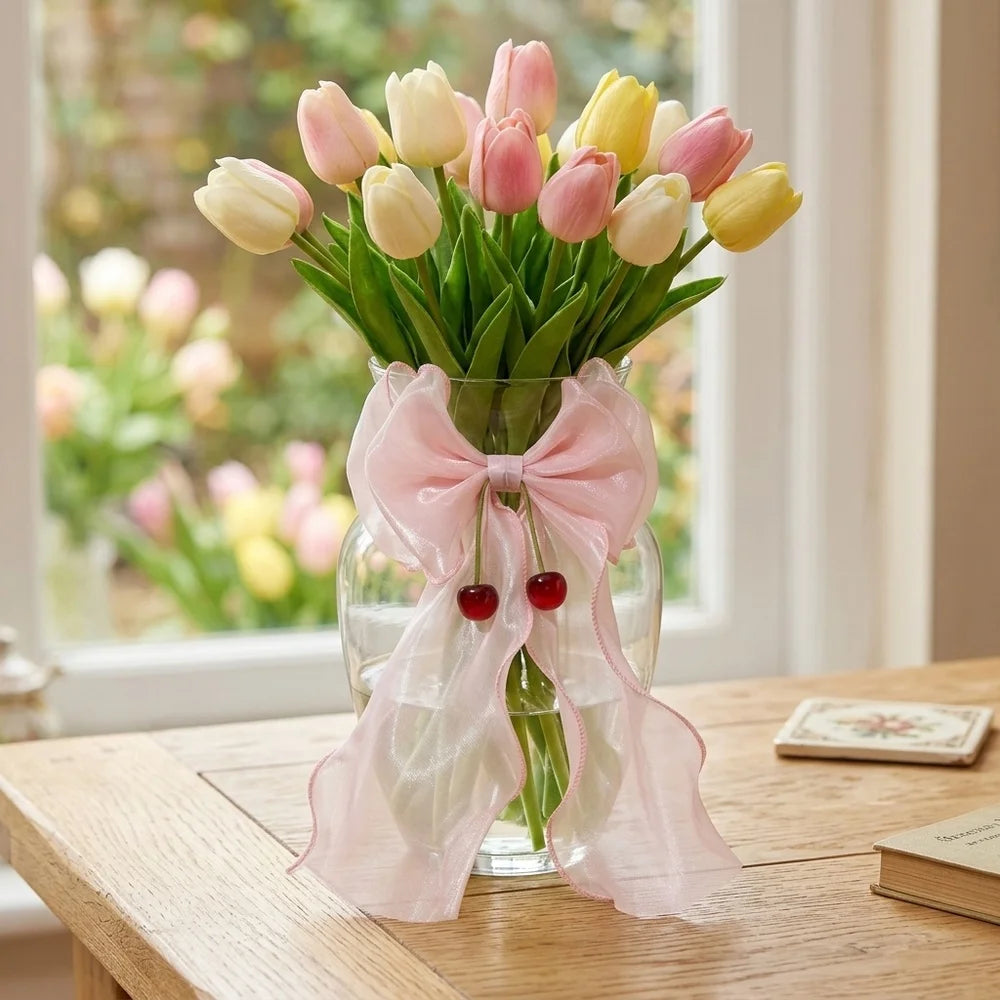 A bouquet of pink and yellow tulips tied with sheer pink ribbon bow curtain tiebacks