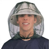 A young man wearing an extra large mosquito net with a face mask.