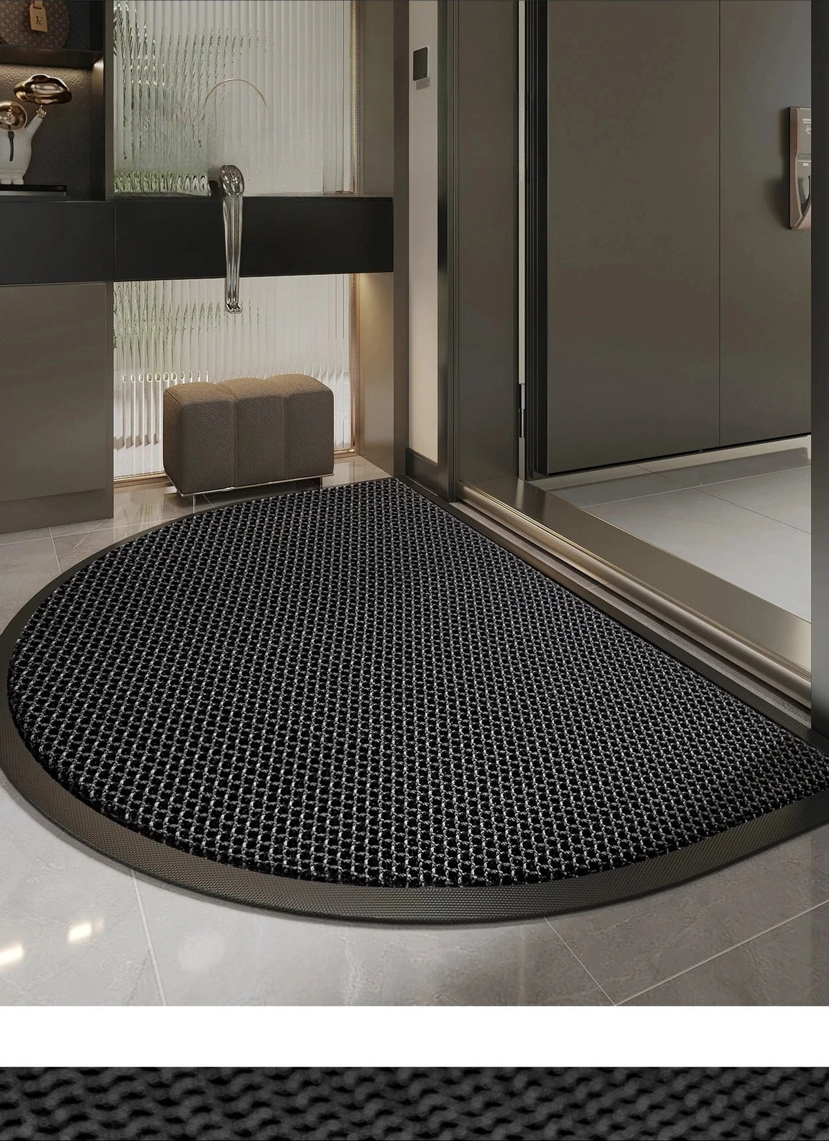 A black half-round non-slip PVC door mat with a diamond pattern placed on a tiled floor.
