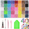 A variety of colorful resin rhinestone kits, tools, and glitter are displayed for crafting and decoration.