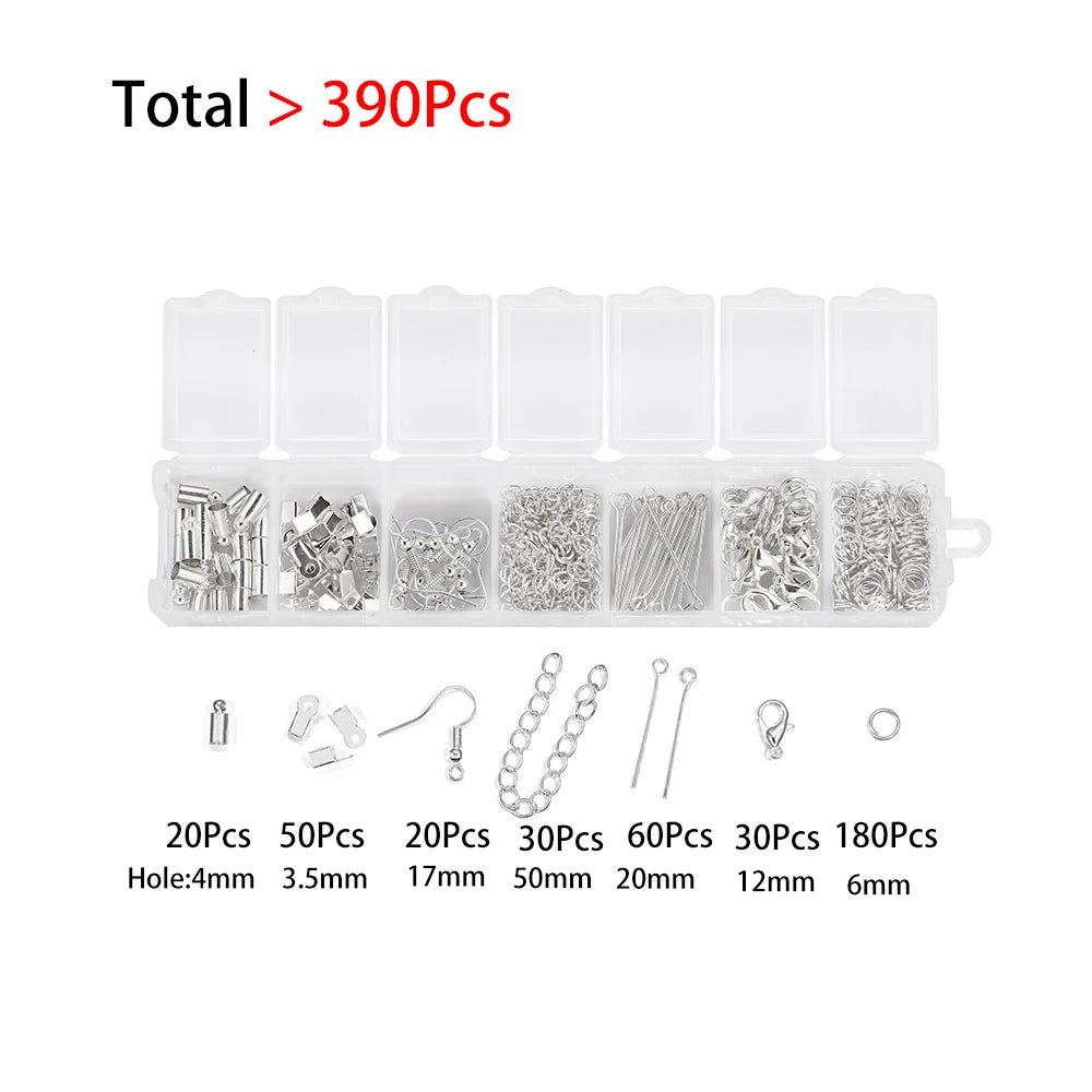 A set of various findings including beads, chains, and clasps for jewelry making.