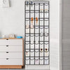 A vertical over-the-door shoe organizer with multiple compartments for storing shoes.