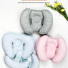 A collection of gray, light blue, and pink anti-deflection head and neck pillows for baby support.