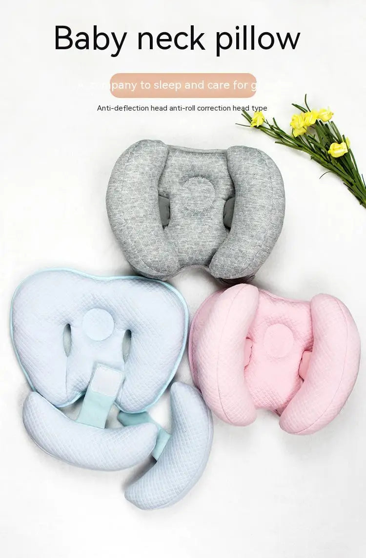 A collection of gray, light blue, and pink anti-deflection head and neck pillows for baby support.