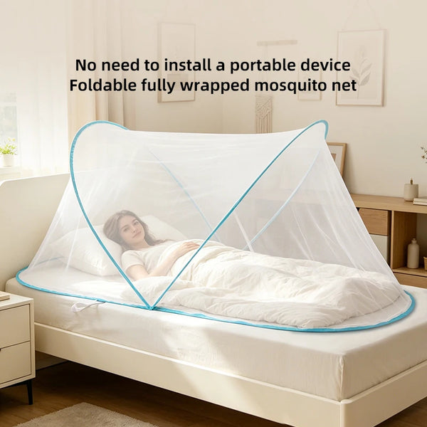 A woman is sleeping under a fully wrapped foldable mosquito net indoors on a bed.
