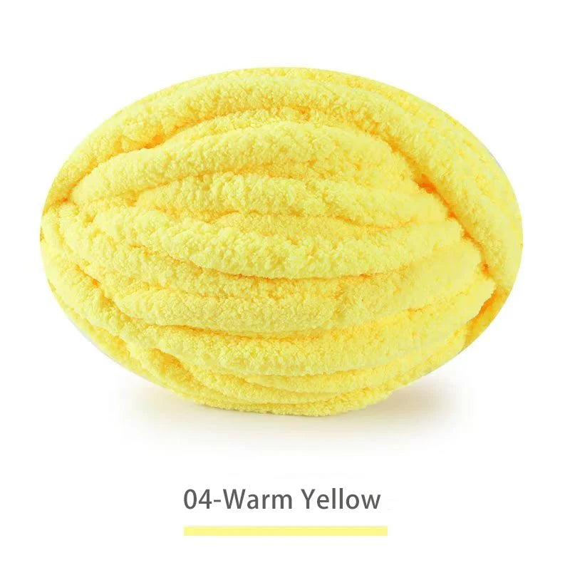 A ball of extra thick hand-knitted yarn in the color Warm Yellow.