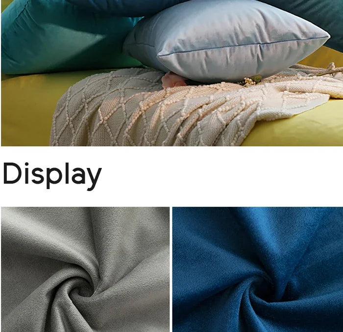 Close-up display of a soft, textured velvet throw pillow cover in shades of blue and gray.
