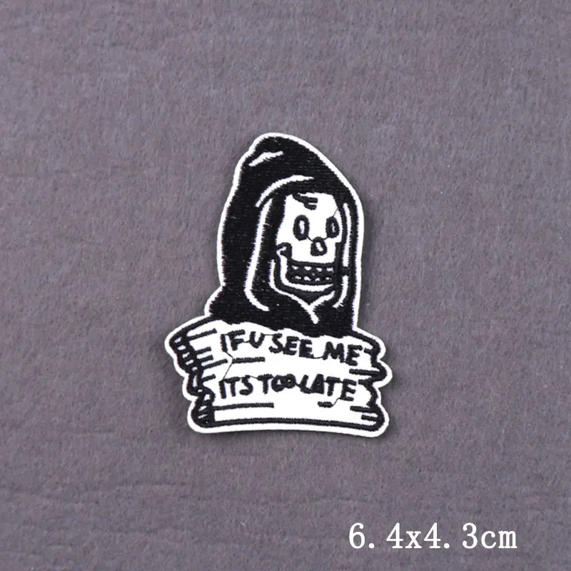 Black embroidered skull iron-on patch featuring a menacing face and the text I see me it's too late