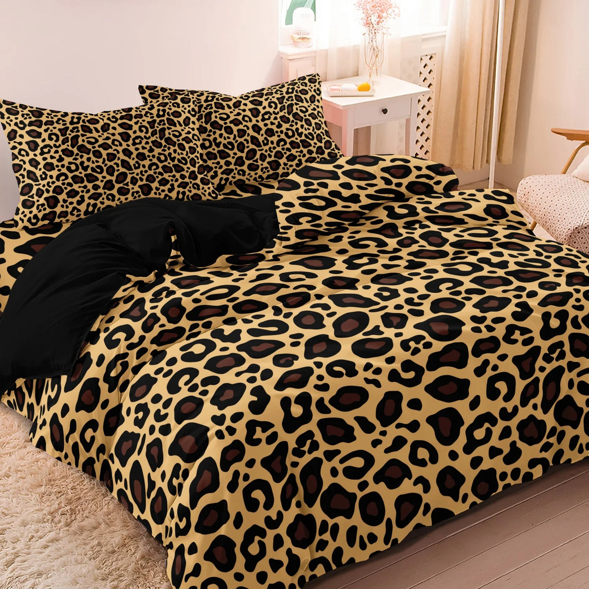 A leopard print duvet cover set featuring a yellow and black animal print on a bed.