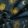 Dark blue fabric featuring a celestial pattern of suns, moons, and stars in gold.
