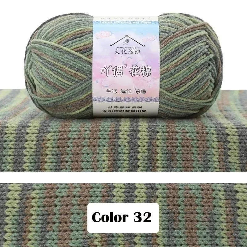 A ball of green and beige gradient yarn labeled as 4-Ply Cotton Knit Yarn for Gradient Projects.