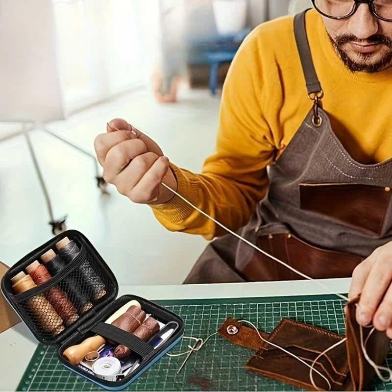 A person is using a professional leather crafting tool kit with waxed thread and needles on a green cutting mat.