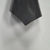 A black heat transfer vinyl sheet is angled against a light gray background.