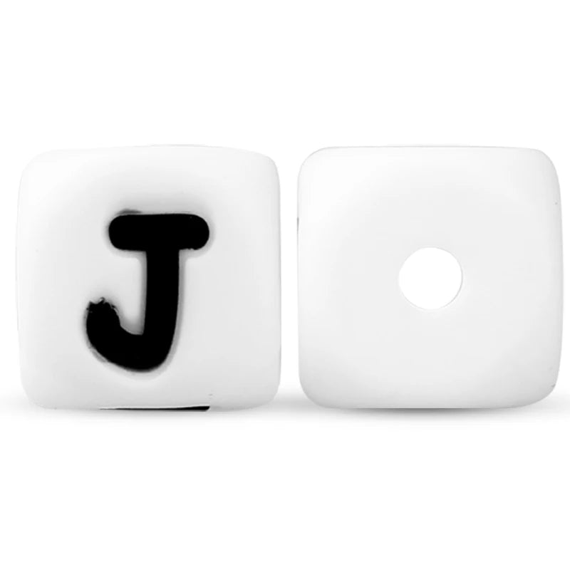 A white silicone alphabet bead shaped like the letter J, displayed against a white background.