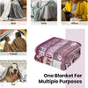 A stack of multi-colored flannel throw blankets with embroidered designs.