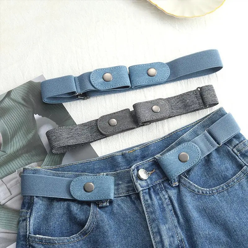 A close-up of a blue invisible stretch belt for pants and dresses with a gray fabric strap.