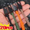Five detachable zipper pull sliders in black, green, orange, and brown are shown being held in a hand.