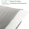 Gray and white pillowcases shown in an envelope design with a pillow core.